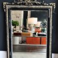Miroir ancien en bois noir et doré