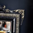 Miroir ancien en bois noir et doré